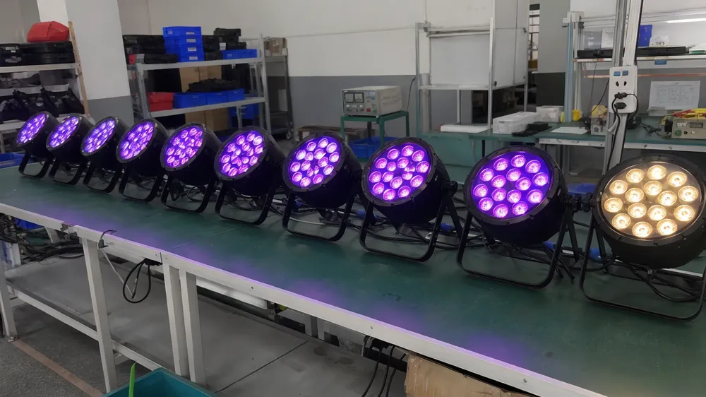 Row of LED par fixtures showing uniform color output across multiple units calibrated to golden sample