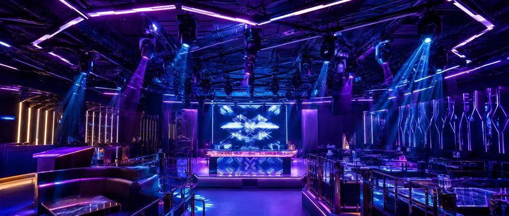 Club DJ lights installed in a professional nightclub venue showing overhead fixtures and neon accent lighting