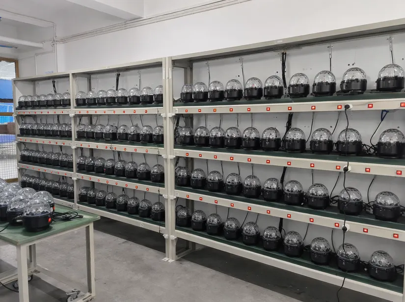 Motor reliability testing bench with disco ball fixture motors undergoing 72-hour run-in at GDMonkey factory