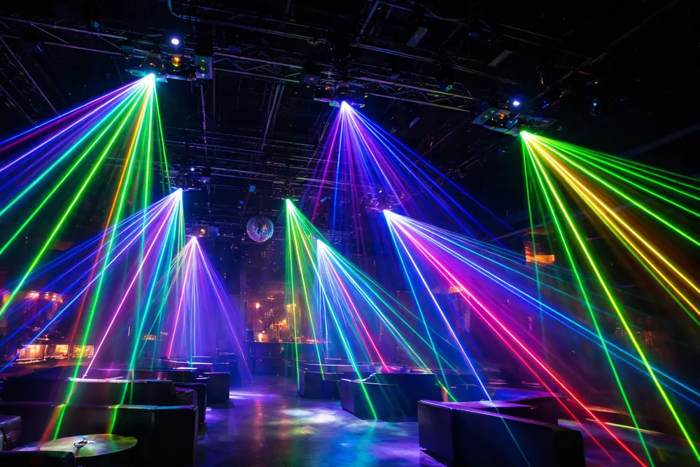 Disco laser lights installed as permanent ceiling fixtures in a nightclub main room