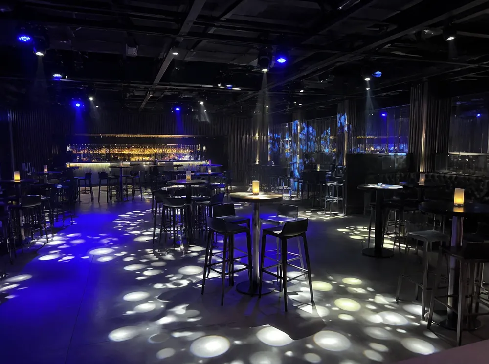 Permanently installed gobo lights projecting atmospheric patterns in a nightclub venue