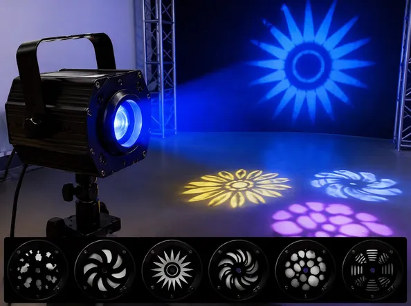 Gobo pattern projection fixture with interchangeable gobo wheels projecting shapes onto dance floor