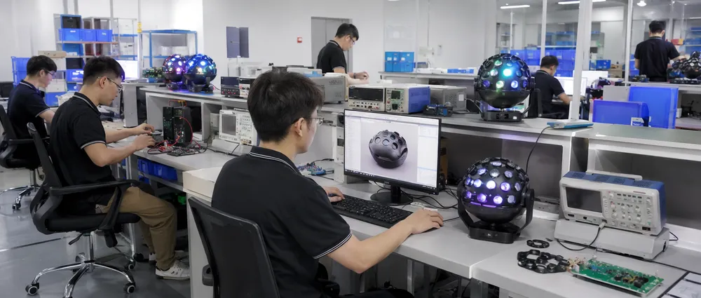 GDMonkey R&D engineering lab with optical engineers developing custom disco DJ light prototypes for OEM clients