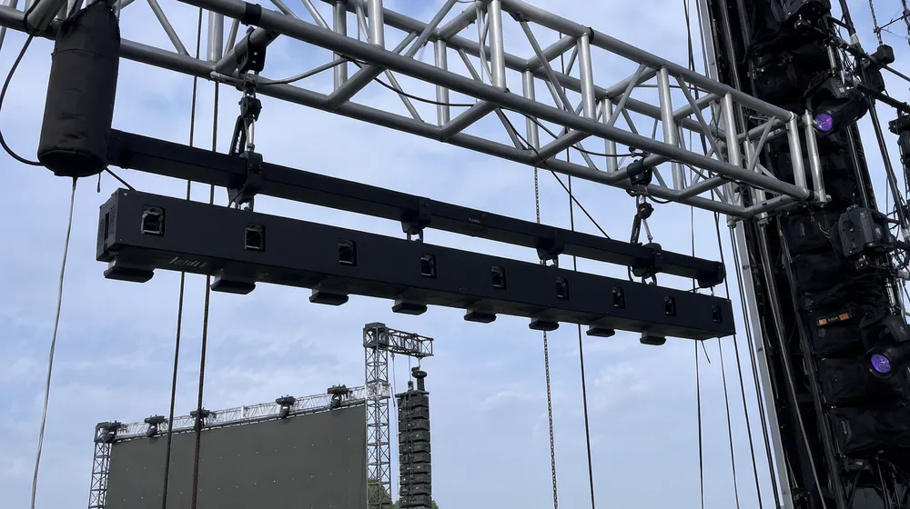 Laser bar fixtures rigged for touring concert production with weight savings