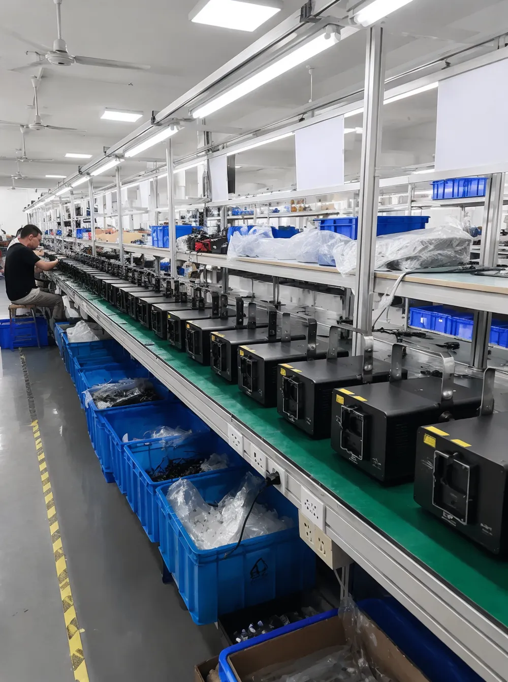 GDMonkey DJ laser lights manufacturing facility in Guangdong showing assembled units on production line