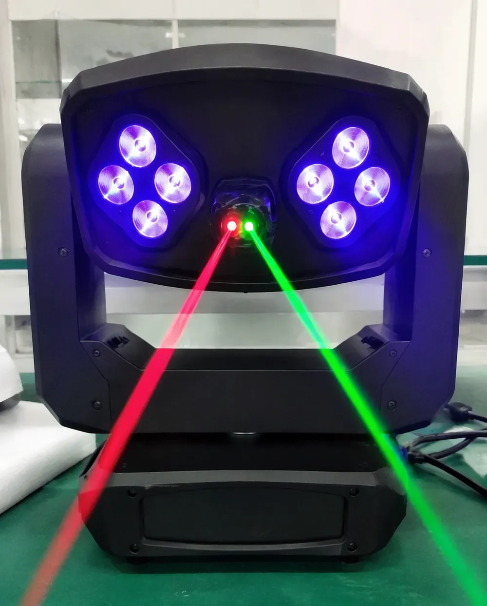 LED laser DJ hybrid fixture showing dual optical paths for LED wash and laser beams
