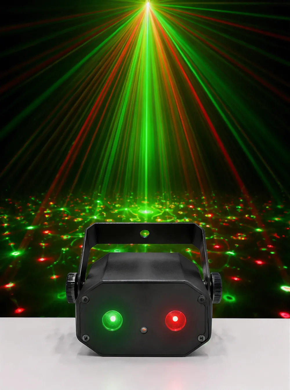 Mini DJ laser light unit projecting green and red beam patterns in a compact ABS housing