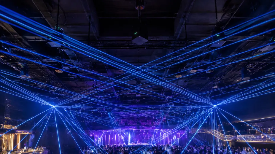 Professional DJ laser lights installed in a nightclub ceiling for permanent show programming