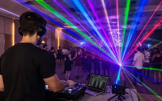 Mobile DJ using compact RGB laser projector for live performance