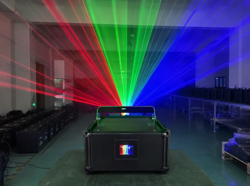 RGB laser projector DJ light unit showing full-color beam output with red, green, and blue laser fans