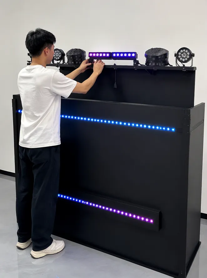 Single operator mounting a DJ booth lights kit on a facade in under 15 minutes
