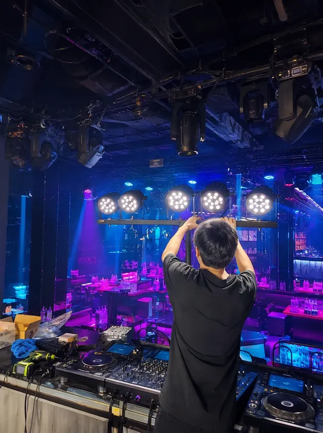 Nightclub DJ booth lighting during annual fixture refresh installation