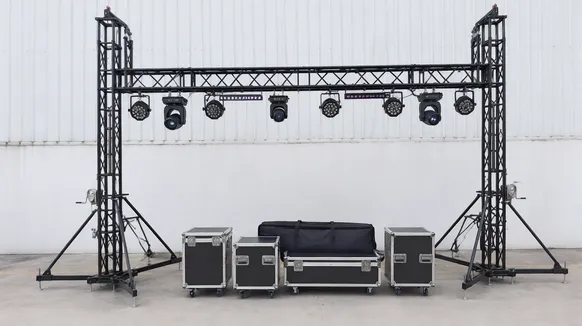 Professional DJ lighting truss system with ground-support verticals, moving heads, and wash bars