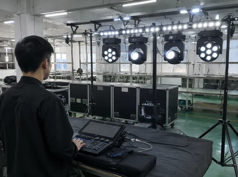 Technician performing full-system DMX integration test on a DJ lights setup kit before shipping