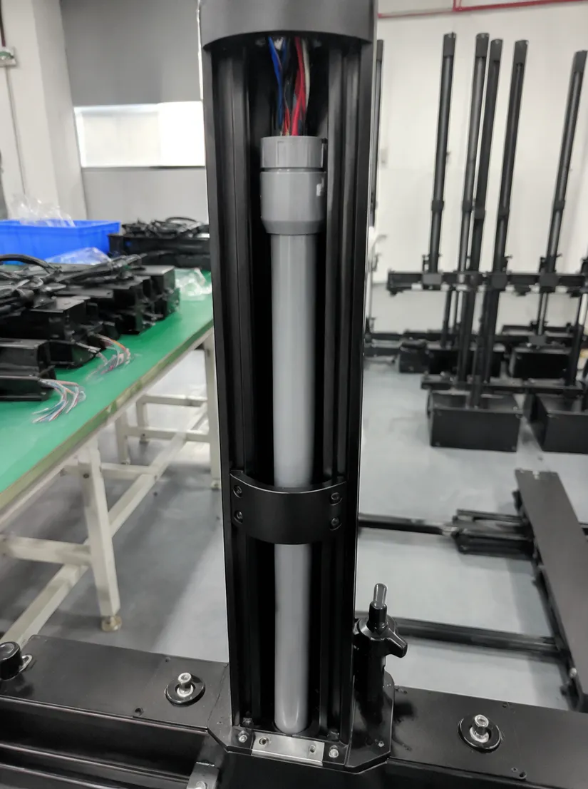 Internal cable harness routed through PVC conduit inside gigbar vertical tube
