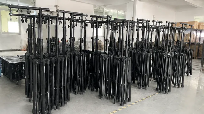 Rental fleet of T bar stands stacked for deployment at event warehouse