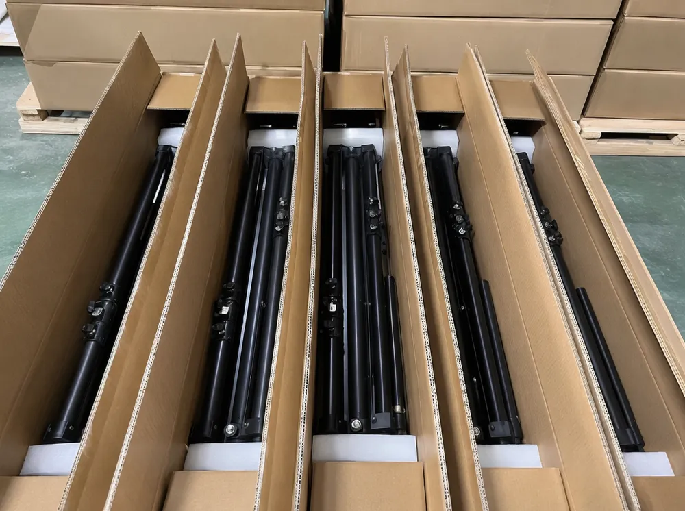 Knocked-down tripod stand packaging nested inside cartons for container loading