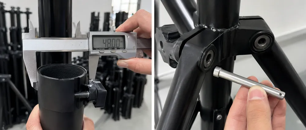 Close-up of CNC-machined locking collar and reamed hinge pin holes on a DJ tripod stand during quality inspection