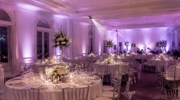 Wedding venue with uplighting and pin spot fixtures creating ambient atmosphere