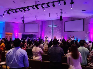 Church sanctuary with LED par lights providing color wash during service