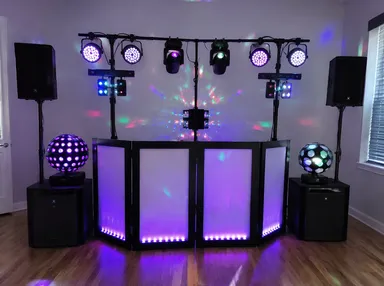 Mobile DJ equipment setup with LED par lights and effects for event lighting