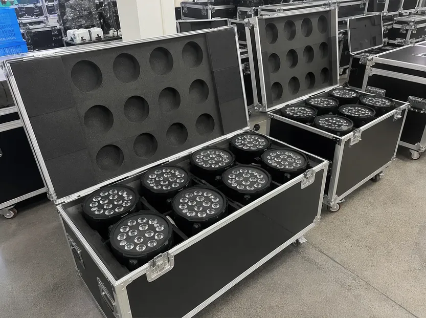 Mobile DJ setup with LED par lights in road cases for fast deployment at events