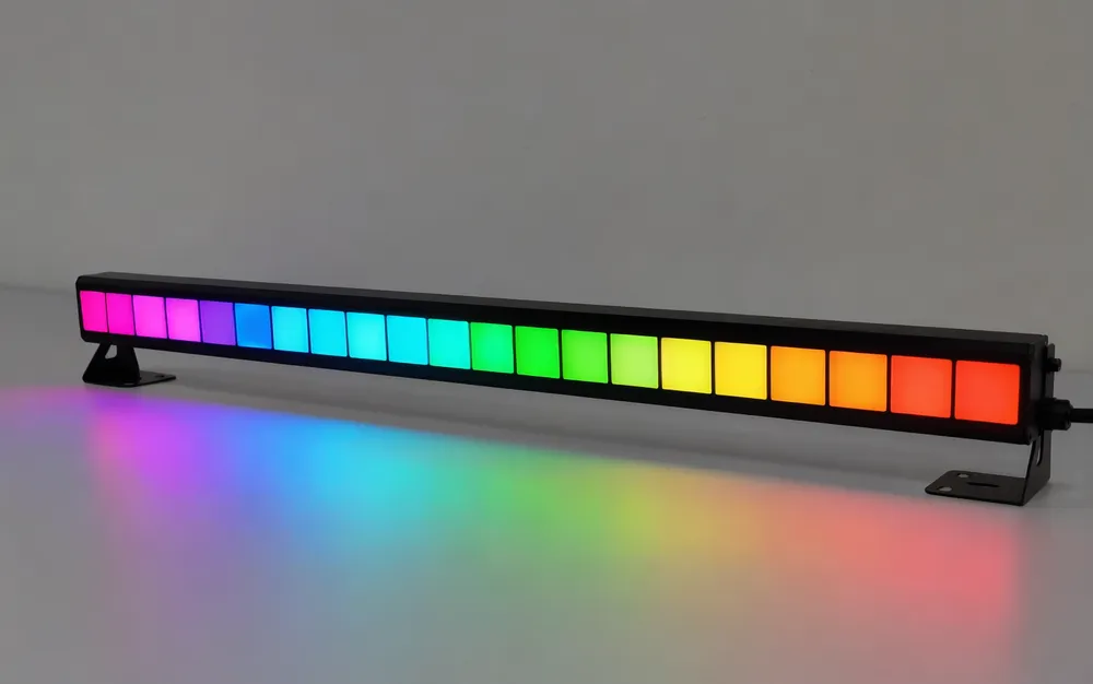 LED DJ pixel bar with individually addressable RGB segments illuminated in chase pattern