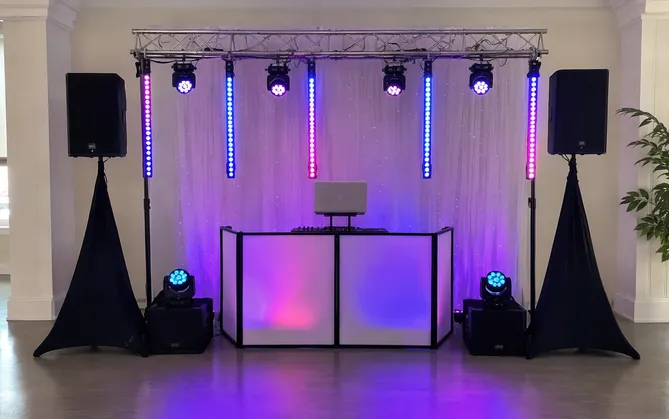 LED pixel bars mounted on truss creating a stage backdrop for mobile DJ setup