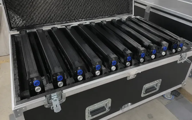 LED pixel bars packed in road case for rental fleet inventory with locking PowerCon connectors visible