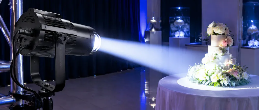LED DJ spotlight fixture showing narrow beam pattern in pin-spot application