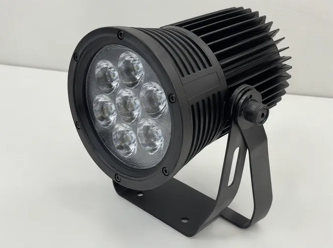 LED DJ spotlight unit showing die-cast aluminum housing with heatsink fins and TIR lens assembly