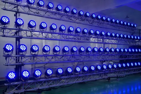 40 identical LED stage lights on truss showing color-matched output across entire batch