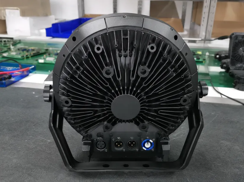 Die-cast aluminum heatsink housing with radial fin pattern on LED DJ stage light rear body
