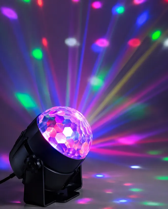 Close-up of a mini LED DJ derby projector showing multi-beam color output