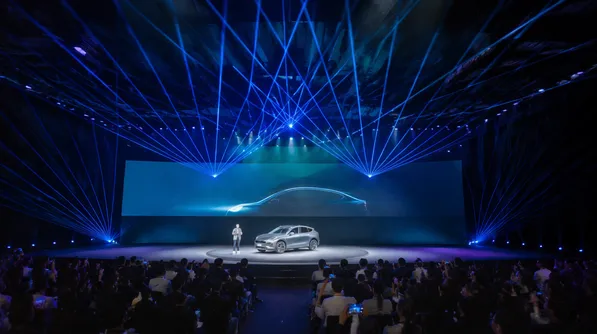 Laser moving DJ lights at corporate product launch event with branded beam effects