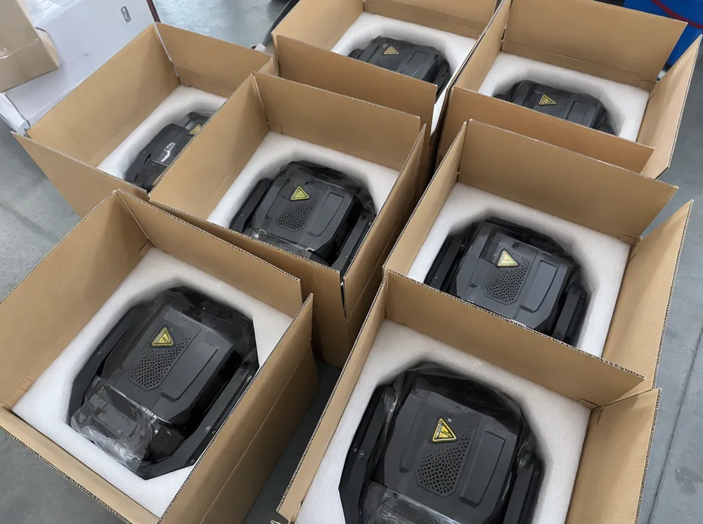 Laser moving head fixtures packed in custom foam cradles inside reinforced master cartons for container shipping