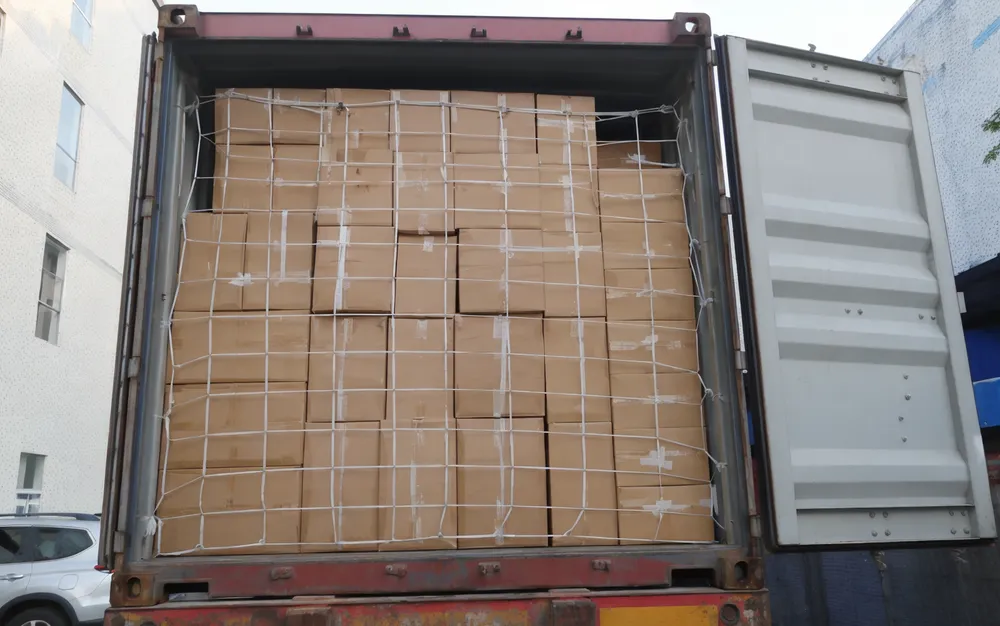 Container load of mini moving DJ lights packed for volume distribution