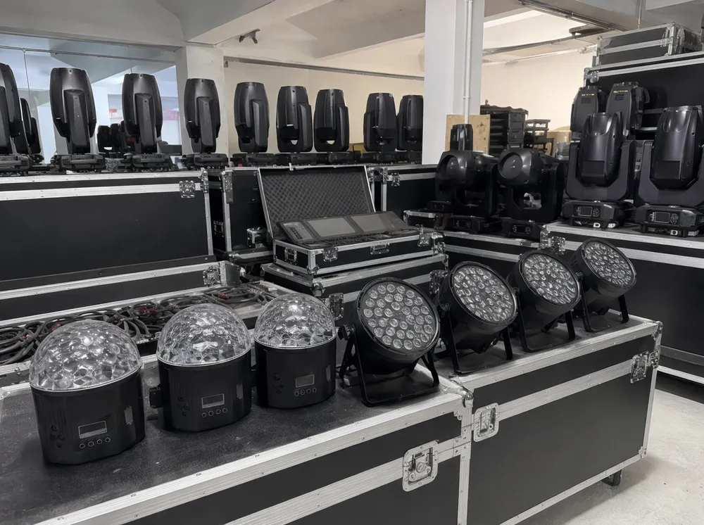 Event rental company warehouse with DMX party DJ lights integrated into fleet alongside PAR cans and moving heads
