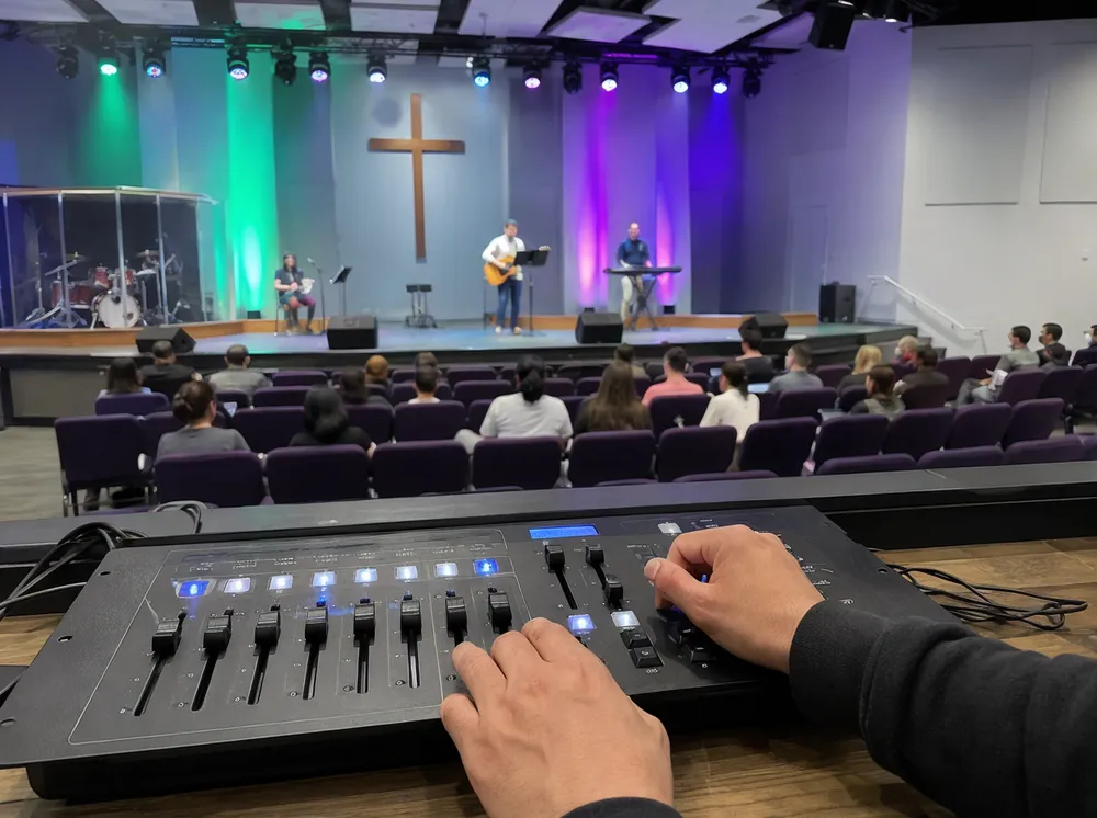 Community worship venue with volunteer-operated DMX party DJ lights on simple scene controller