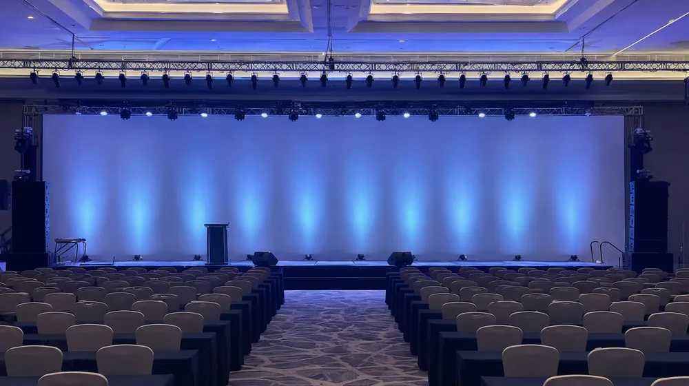 Corporate conference ballroom with consistent wash lighting across keynote stage