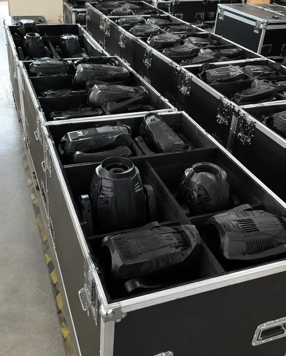 Event stage lighting fixtures loaded in flight cases ready for transport