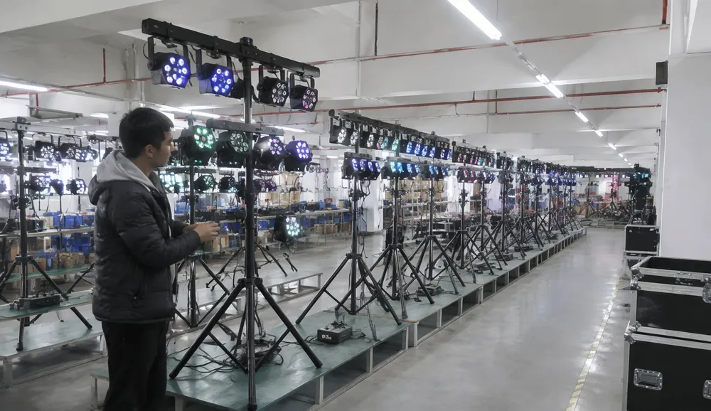 Factory quality inspection line for party DJ lights tripod systems — assembled system verification