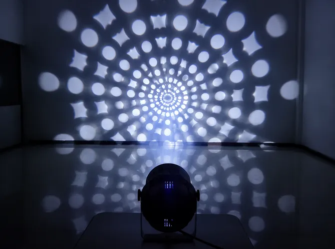 Moonflower effect fixture with single-source LED behind rotating gobo wheel creating sharp pattern projections