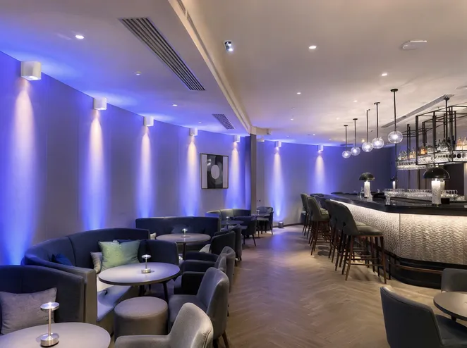 Wireless DJ lights installed as permanent ambient fixtures in a hospitality bar lounge setting