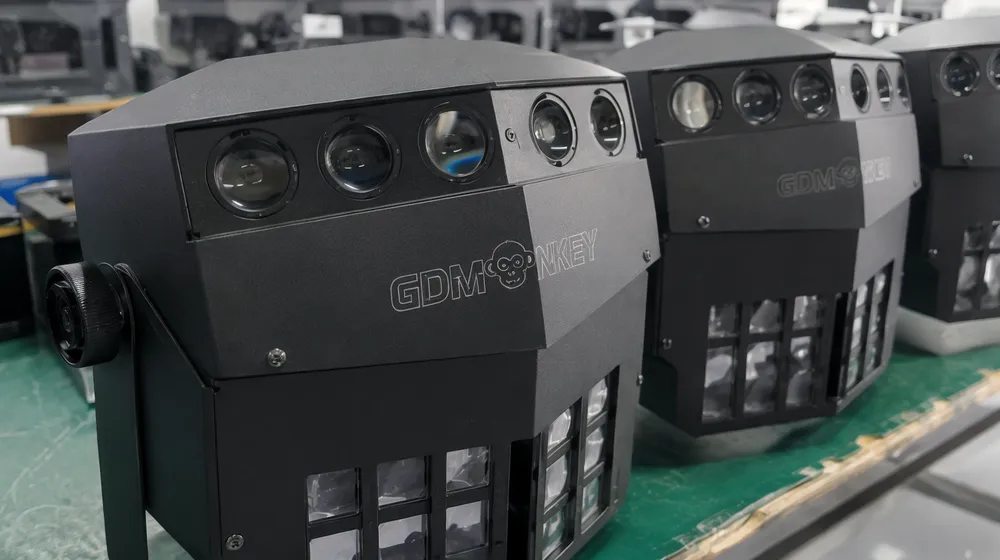 OEM branding on DJ effect fixture housing showing laser-engraved logo placement