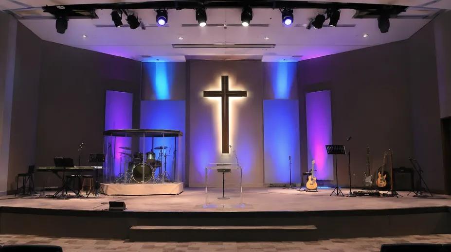 Church stage with professional lighting system providing warm wash and RGB effects for worship services