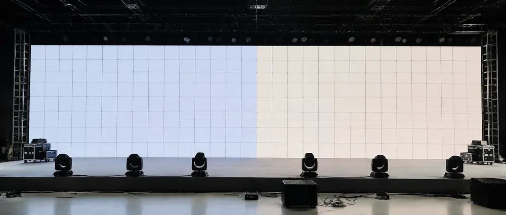 Visual comparison of LED panel batches showing white point color temperature mismatch on stage
