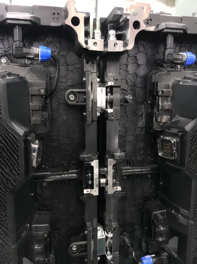 Close-up of modular LED backdrop panel mechanical and electrical locking mechanism during assembly