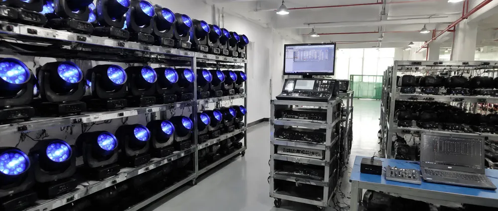 GDMonkey quality control testing lab showing 48-hour aging tests and DMX signal verification equipment for stage lighting fixtures