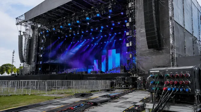 Outdoor festival stage with IP65 rated wash fixtures and weather-sealed infrastructure